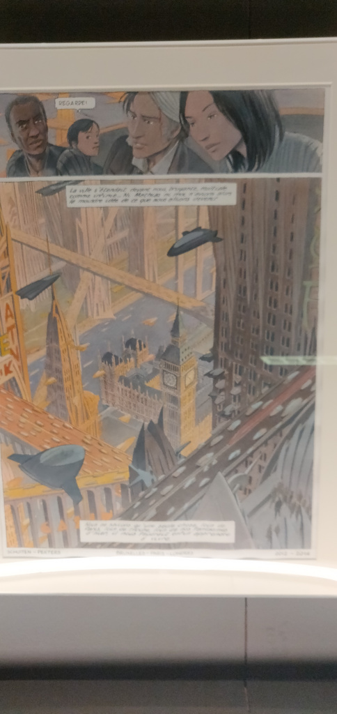 Pagina uit stripboek, grote panel met een stad met vliegende auto's.