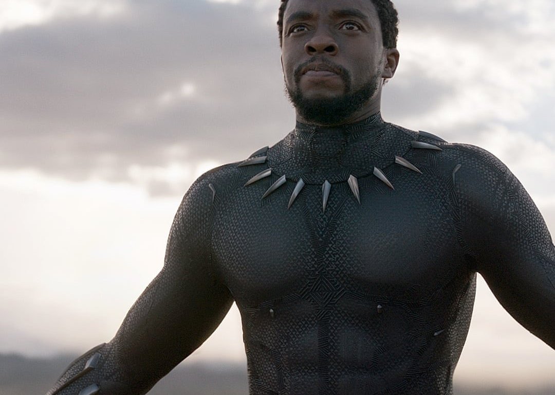 King T'Challa in Black Panther Suit with teeth around his neck, without a mask.